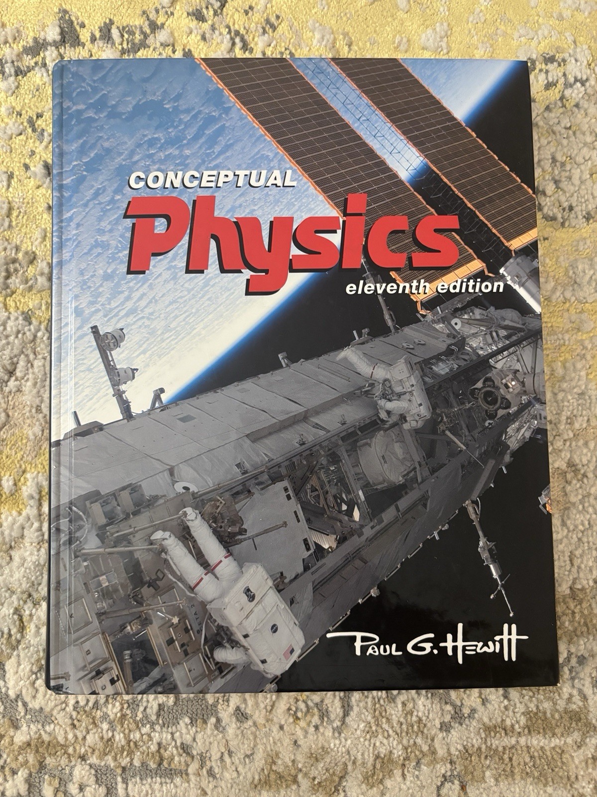 Conceptual Physics 11th Edition by Paul G. Hewitt Hardcover Textbook